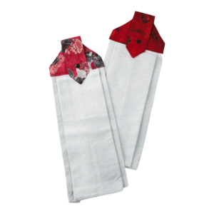Two white hanging kitchen towels with decorative red and black floral fabric tops and button closures.