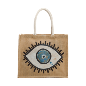 A jute tote bag featuring a hand-painted eye design on both sides, with black eyelashes surrounding a blue and white eye, and sturdy white handles.